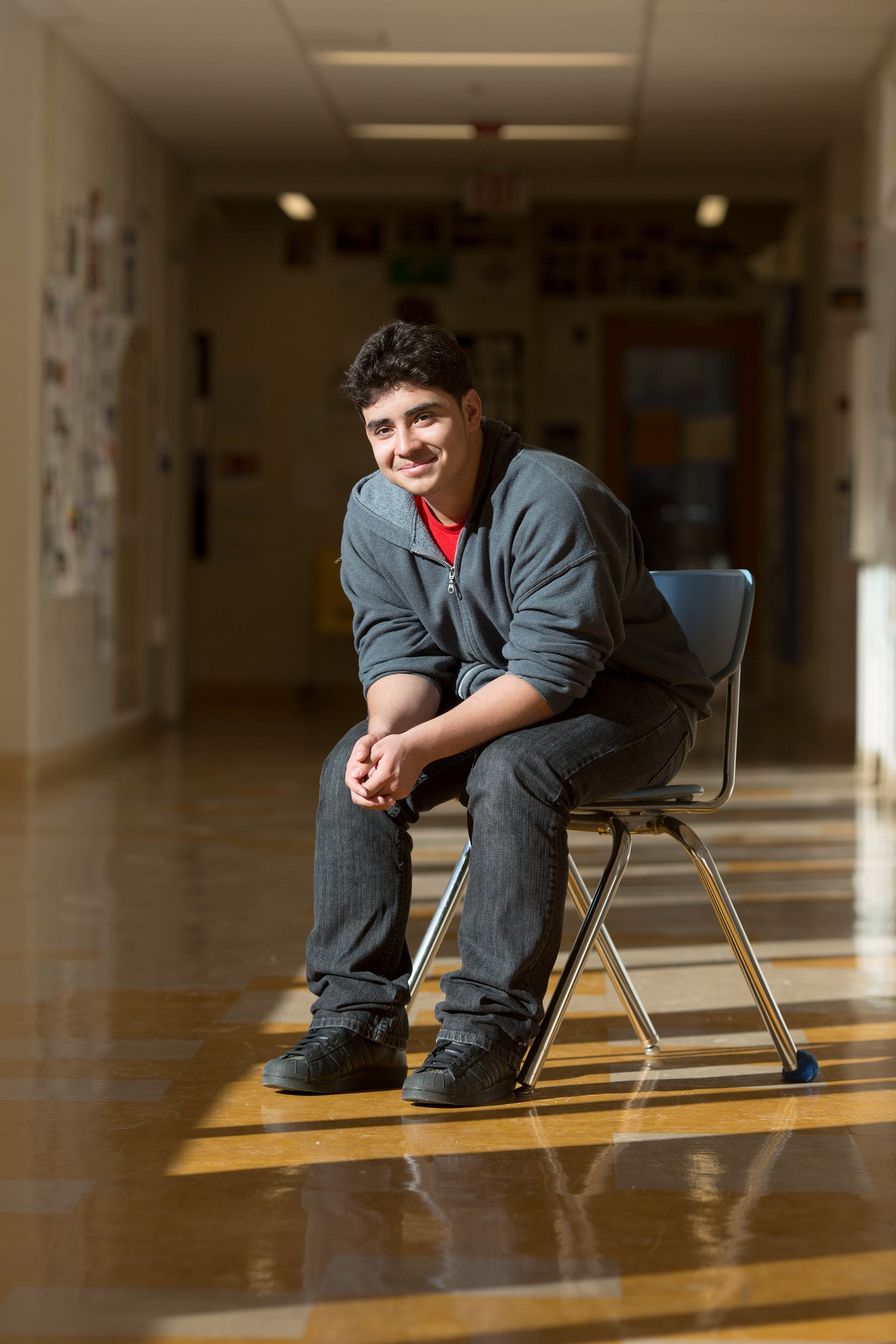 Student sitting in hallway