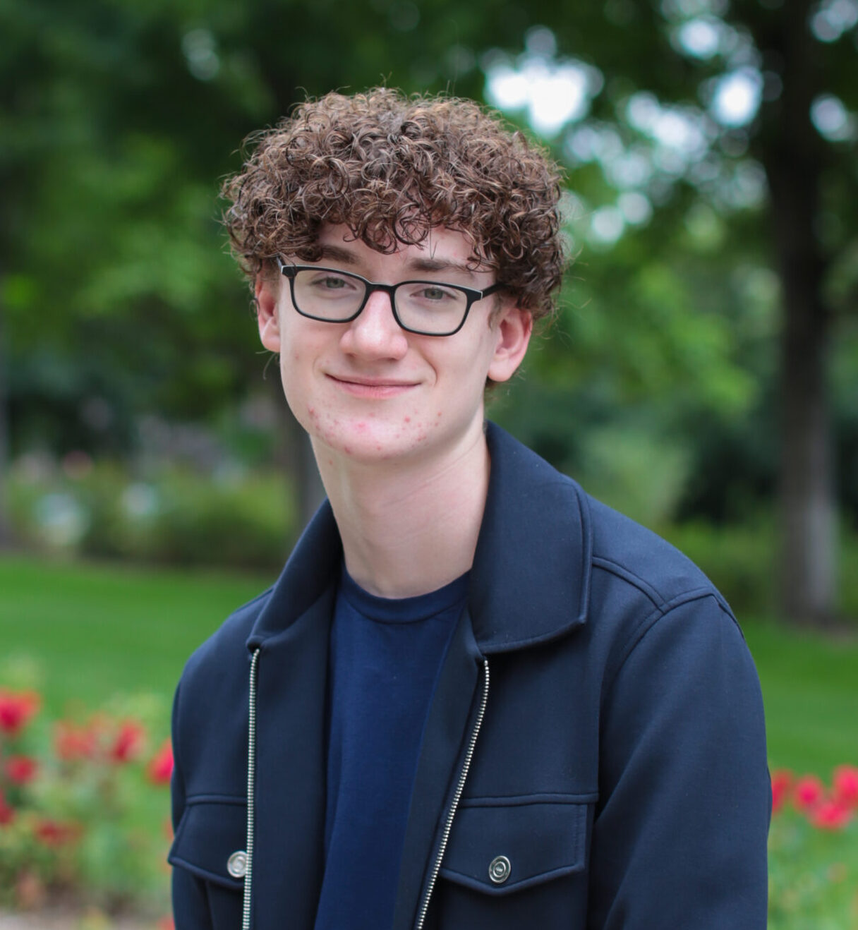 Headshot of Simon Forbes (he/him)